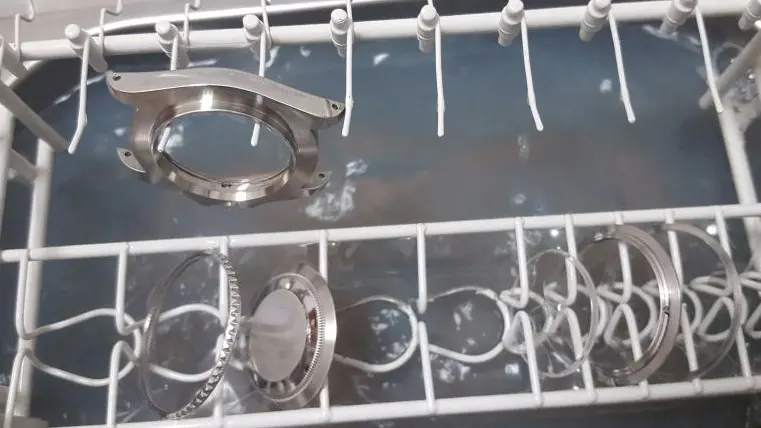 Watch case and bezel components during cleaning